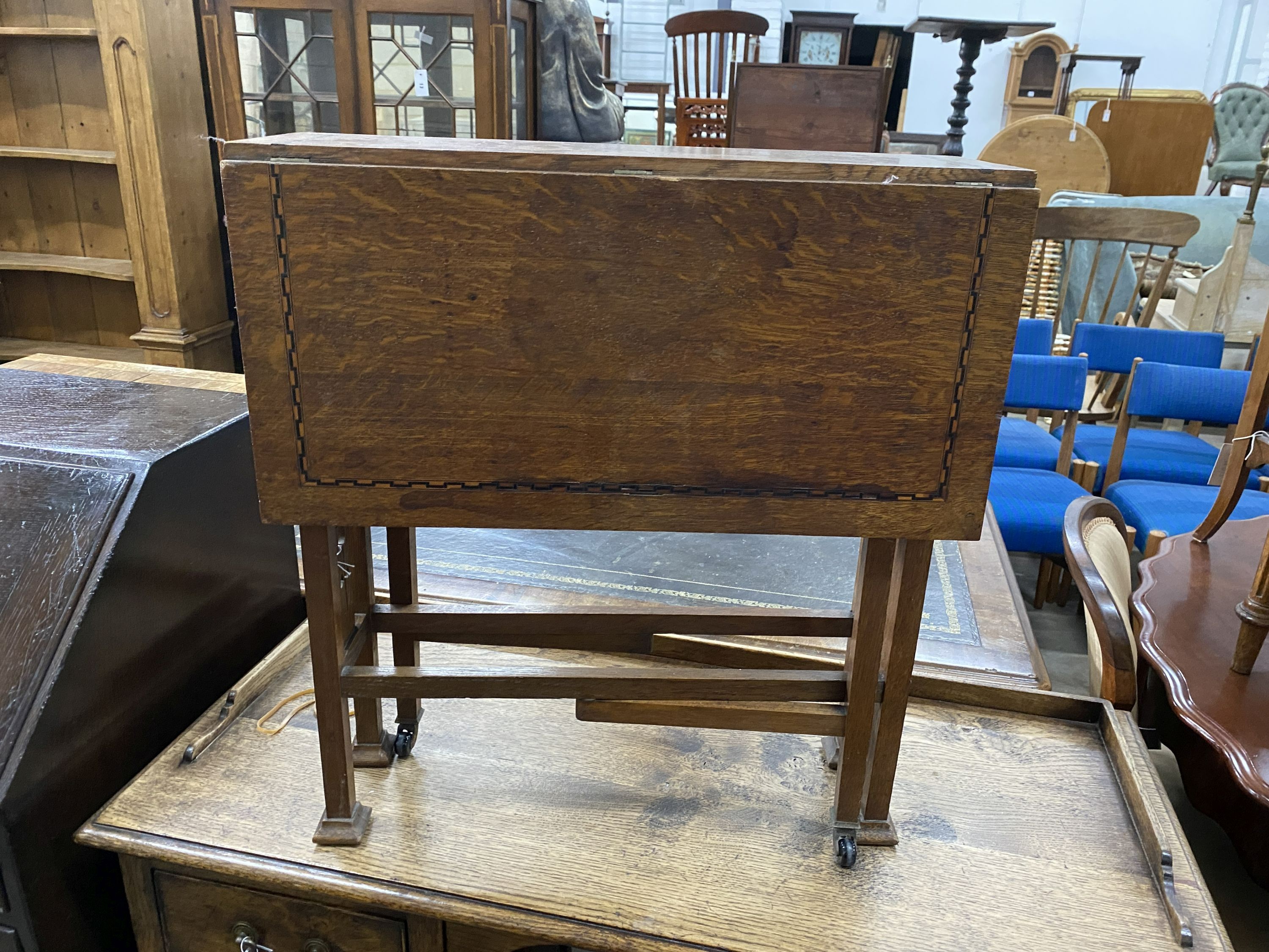 An Arts & Crafts inlaid oak Sutherland table, width 56cm, depth 19cm, height 61cm